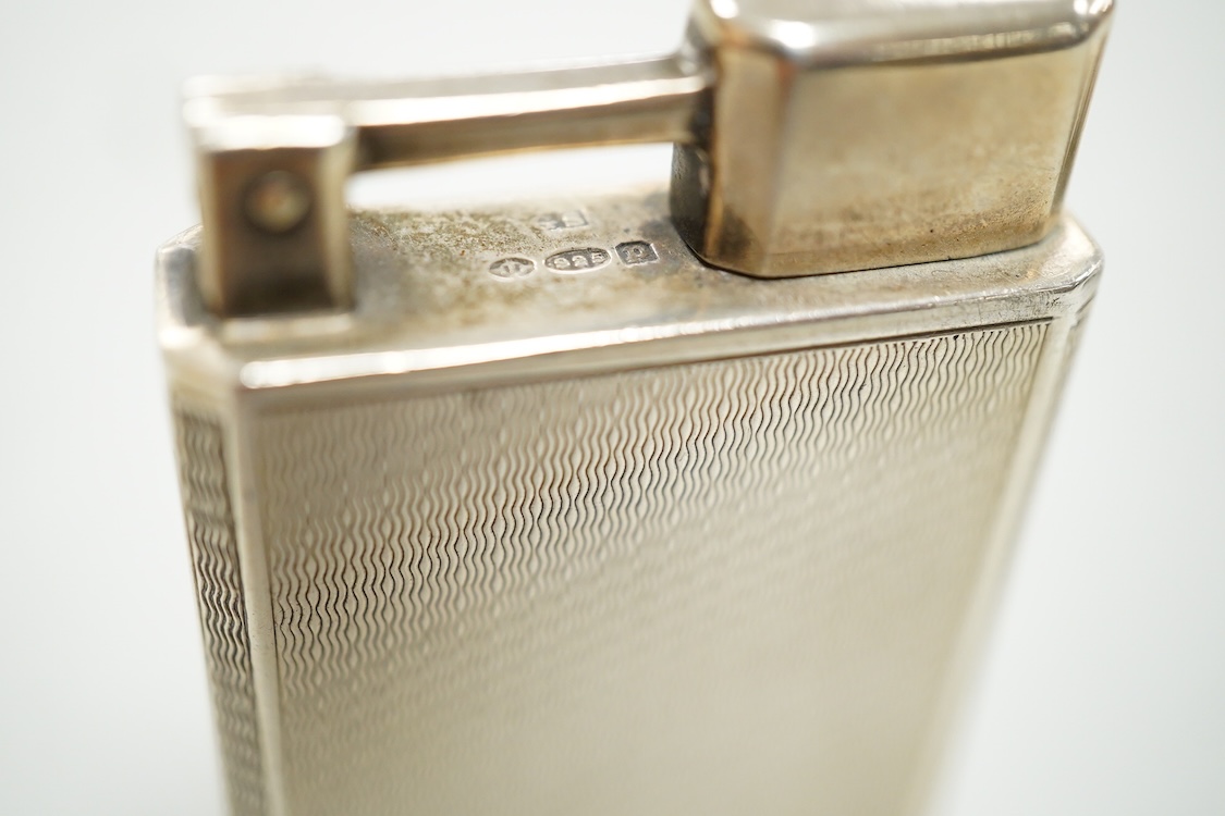 Two vintage lighters comprising an Everest 925 silver lighter, 49mm and a Dunhill plated lighter